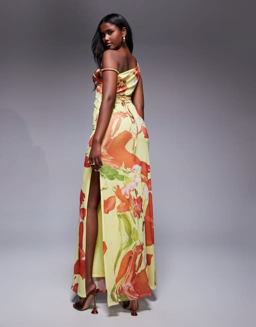 ASOS DESIGN twist shoulder mesh maxi dress with lace up back in yellow and orange floral print