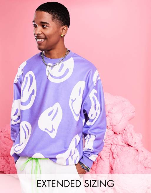 ASOS DESIGN – Übergroßes Festival-Sweatshirt aus Fleece in Lila mit All-over-Print