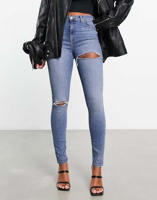ASOS DESIGN – Ultimate – Eng geschnittene Jeans in Blau im Used-Look mit Rissen