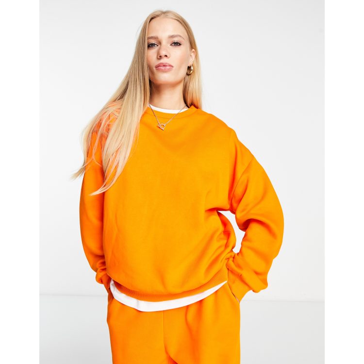 ASOS DESIGN oversized sweatshirt in neon orange