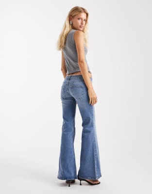 Asos Design Ultra Low Flare Jeans In Blue