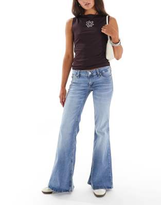 ASOS DESIGN ultra low flare jeans in pale wash blue