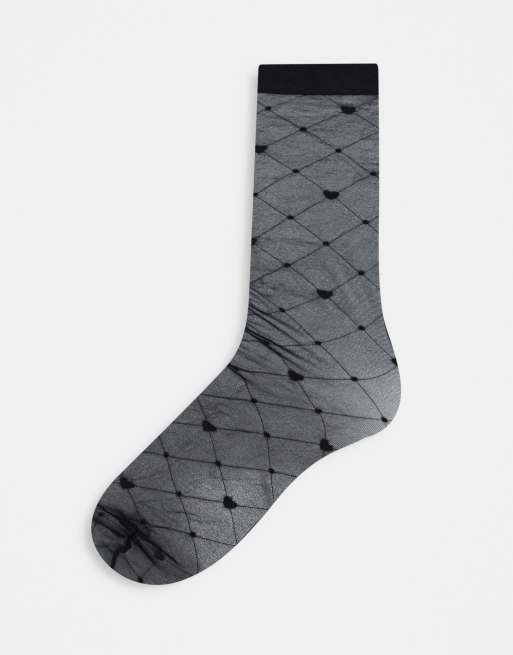 ASOS DESIGN under the knee sheer sock with heart and diamond print in black
