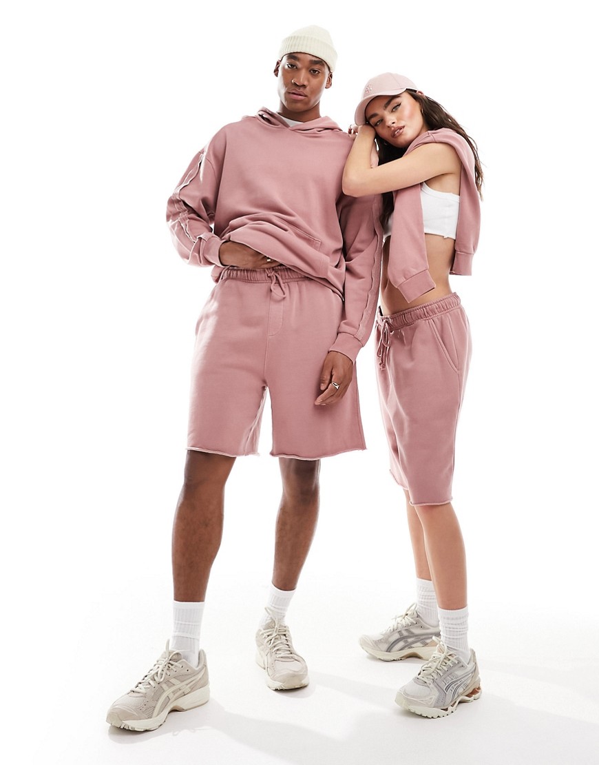 ASOS DESIGN unisex co-ord oversized shorts with raw hem in washed pink
