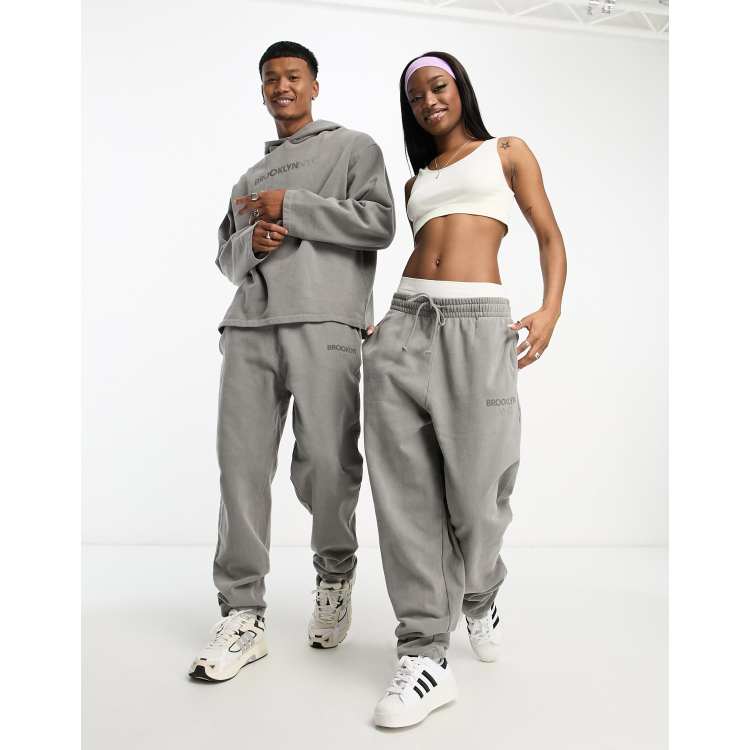 ASOS Design unisex co-ord relaxed joggers with print in charcoal wash