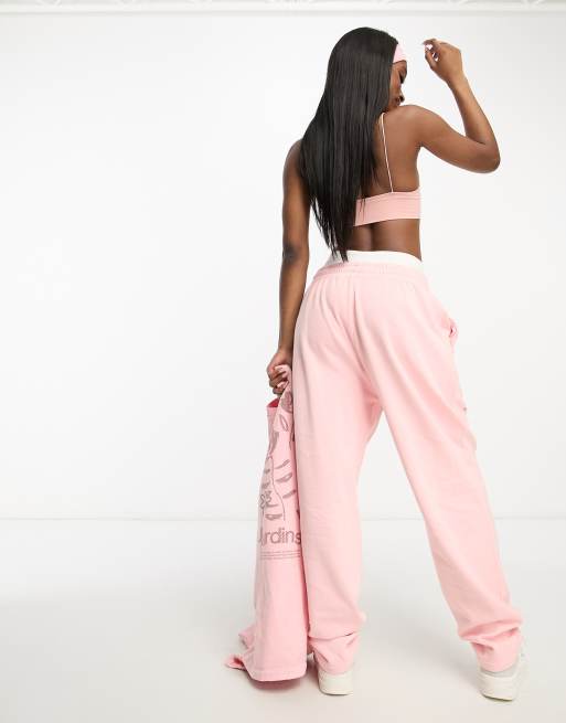 ASOS Design unisex co ord relaxed joggers with prints in pink wash