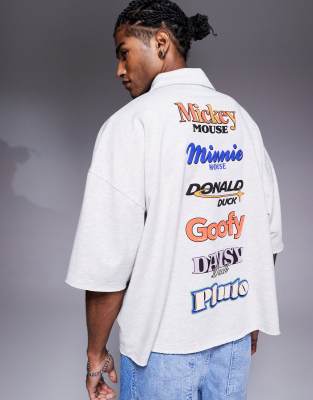 ASOS DESIGN Unisex extreme oversized short sleeve polo shirt with embroidered Disney logos in white