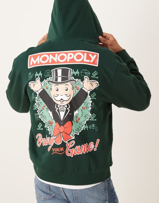 ASOS DESIGN unisex oversized hoodie with Christmas Monopoly print in green, 2 of 4