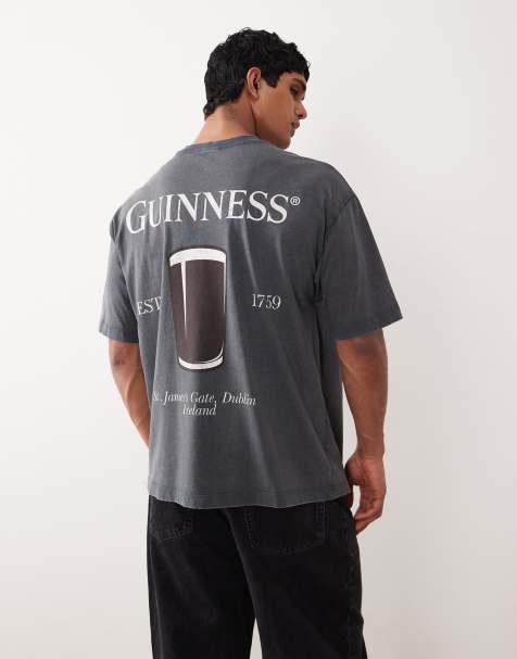 ASOS DESIGN unisex oversized t-shirt with Guinness prints in washed black - view 1