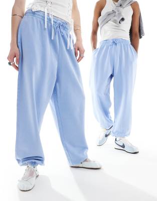 FhyzicsShops DESIGN unisex oversized trackies in acid wash denim blue