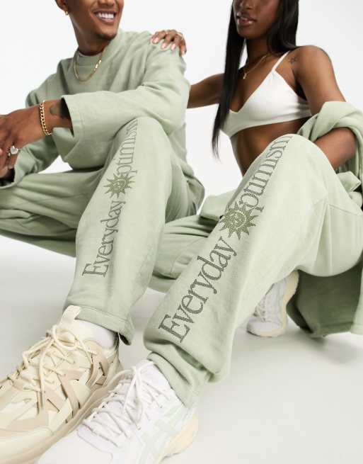 ASOS DESIGN unisex relaxed sweatpants with leg print in olive wash - part of a set 