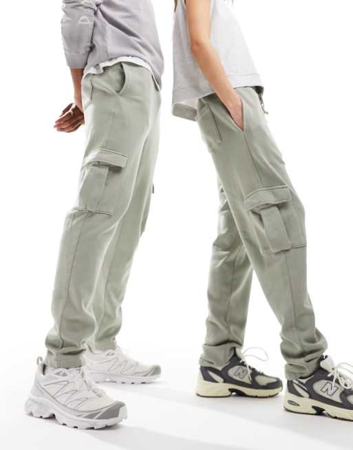 ASOS DESIGN Unisex – Zielone zwężane joggersy z bojówkowymi kieszeniami i efektem sprania