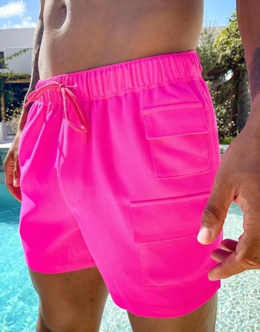ASOS DESIGN utility swim shorts with patch pockets in hot pink | ASOS