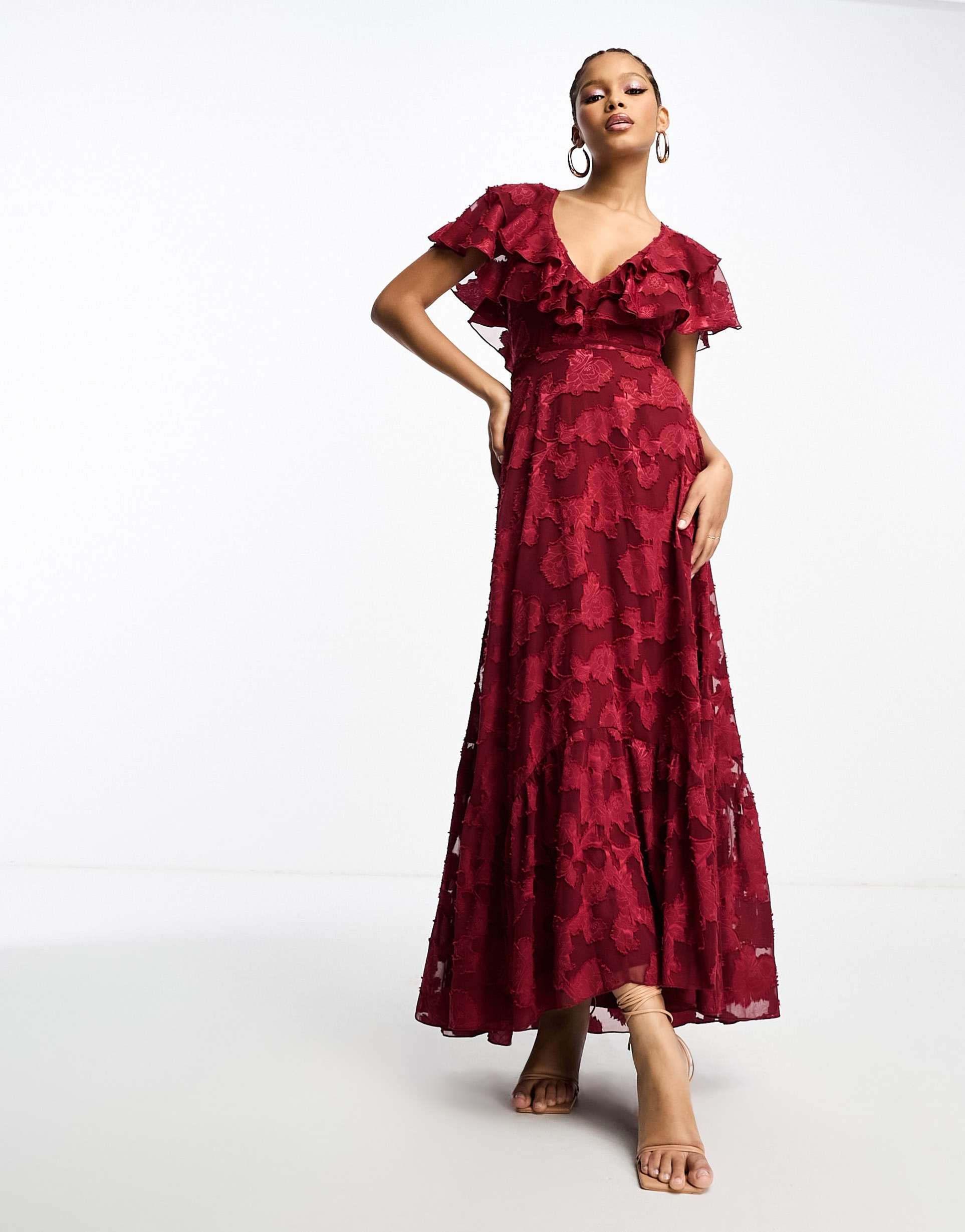 asos design v front v back ruffle maxi dress with flutter sleeve and tie back in textured jacquard in burgundy