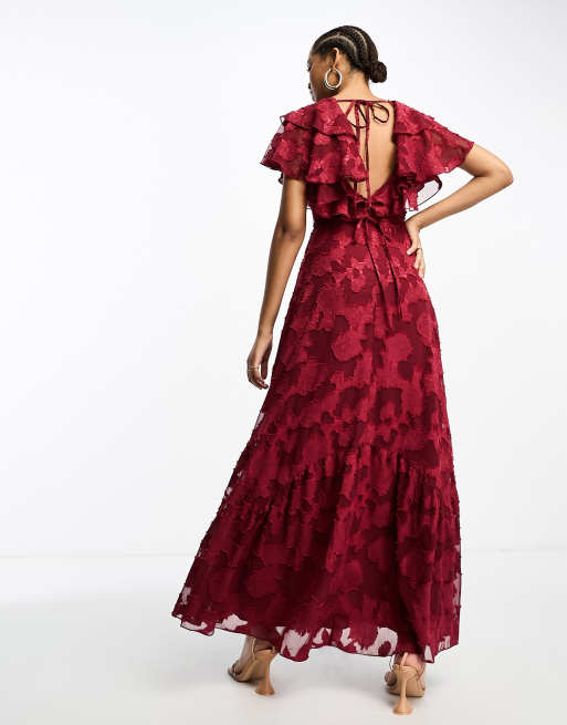 ASOS DESIGN v front v back ruffle maxi dress with flutter sleeve and tie back in textured jacquard in burgundy