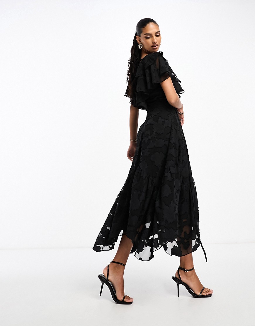 ASOS DESIGN v front v back ruffle midi dress with flutter sleeve and tie back in textured jacquard in black