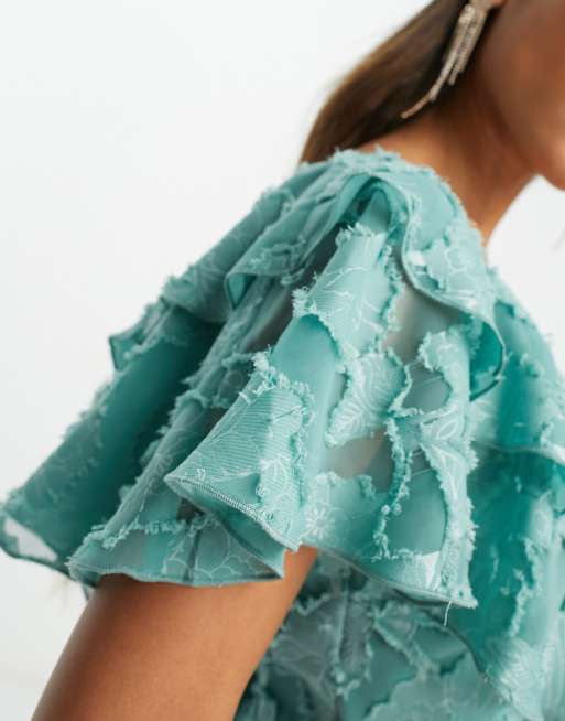 asos v front v back ruffle midi dress ASOS DESIGN v front v back ruffle midi dress with flutter sleeve and tie  back in textured jacquard in sea green