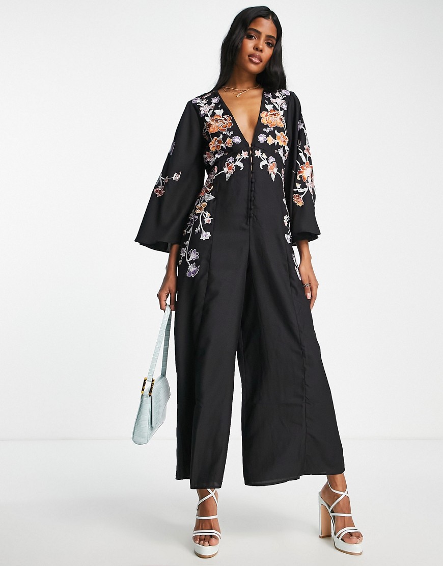 ASOS DESIGN V neck button up jumpsuit with flared sleeves and embroidery in black