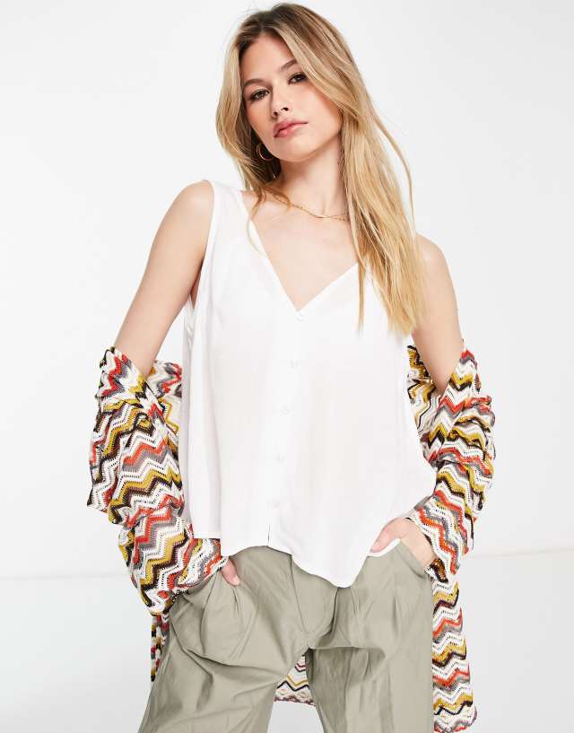 ASOS DESIGN v-neck crinkle tank top with shell buttons in ivory