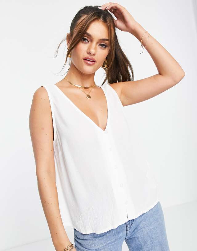 ASOS DESIGN v-neck crinkle tank top with shell buttons in ivory