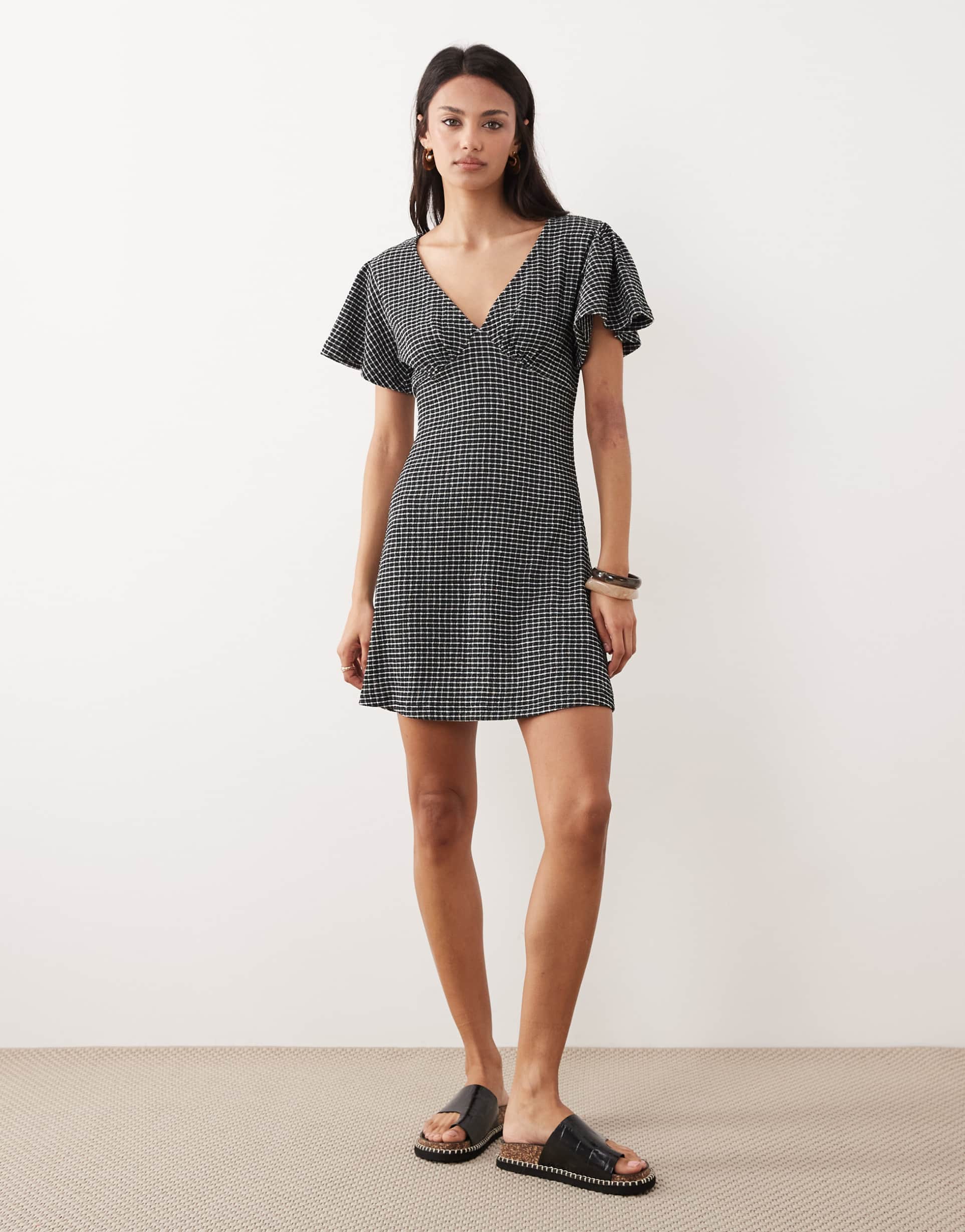 asos design v neck floaty mini dress in black gingham texture