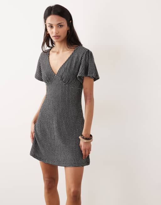 ASOS DESIGN v neck floaty mini dress in black gingham texture, 3 of 4