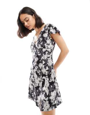 Asos Design V Neck Flutter Sleeve Mini Tea Dress In Black And White Blurred Floral Print-multi