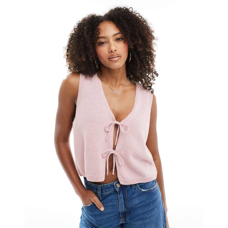 ASOS DESIGN v neck knit tank top with bow tie front in pink