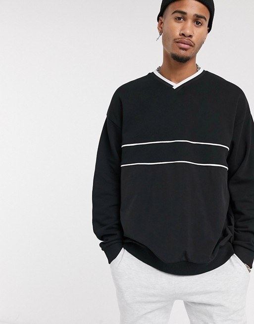 ASOS DESIGN v neck oversized sweatshirt in black with white piping details