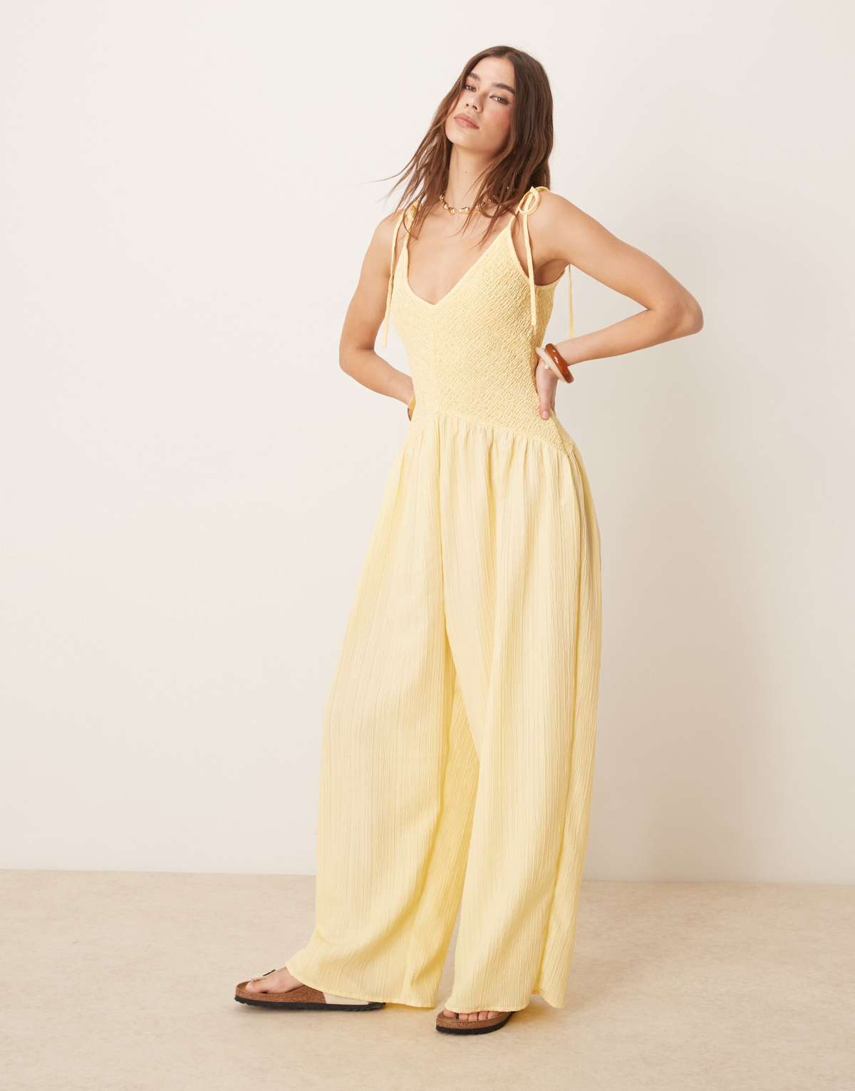 ASOS DESIGN V neck poly crinkle dropped waist jumpsuit in lemon yellow