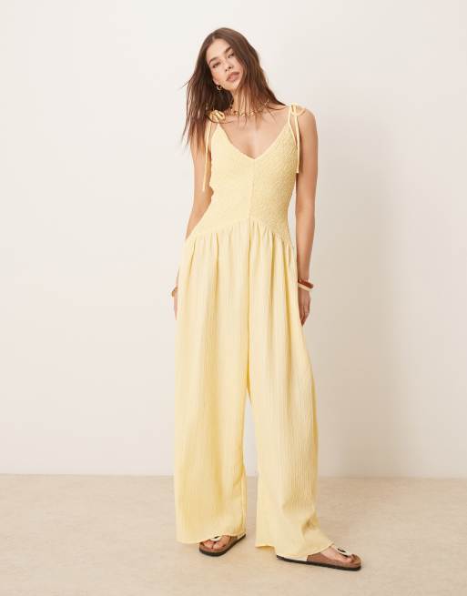 ASOS DESIGN V-neck poly crinkle dropped waist jumpsuit in lemon yellow