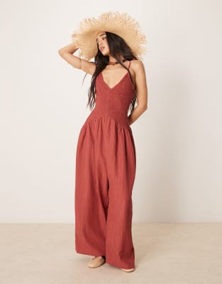 ASOS DESIGN V neck poly crinkle dropped waist jumpsuit in rust-Red