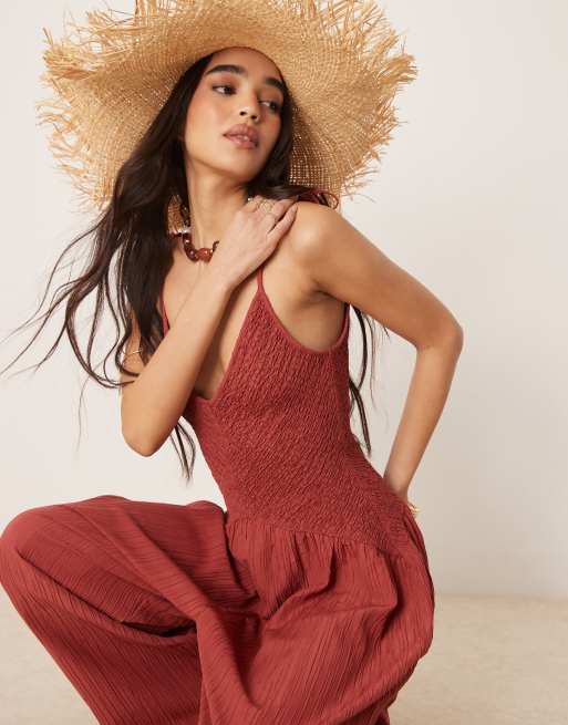 ASOS DESIGN V neck poly crinkle dropped waist jumpsuit in rust