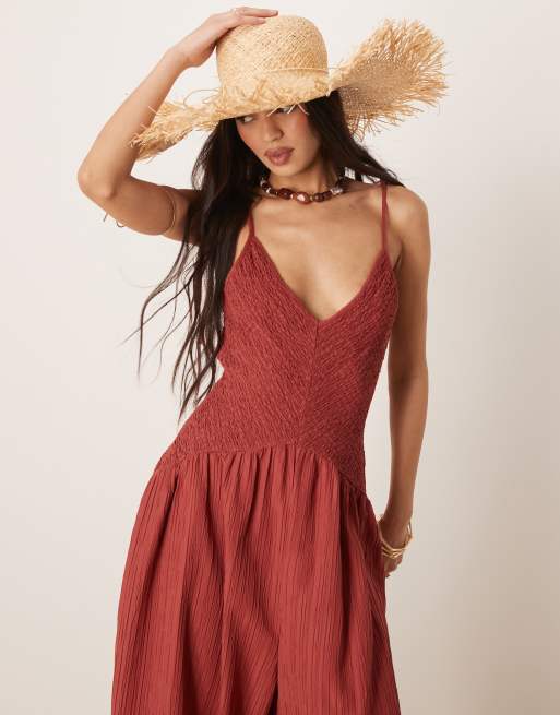 ASOS DESIGN V neck poly crinkle dropped waist jumpsuit in rust