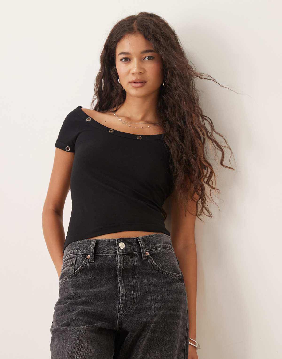 ASOS DESIGN v neck rib long sleeve top with ring stud detail in black