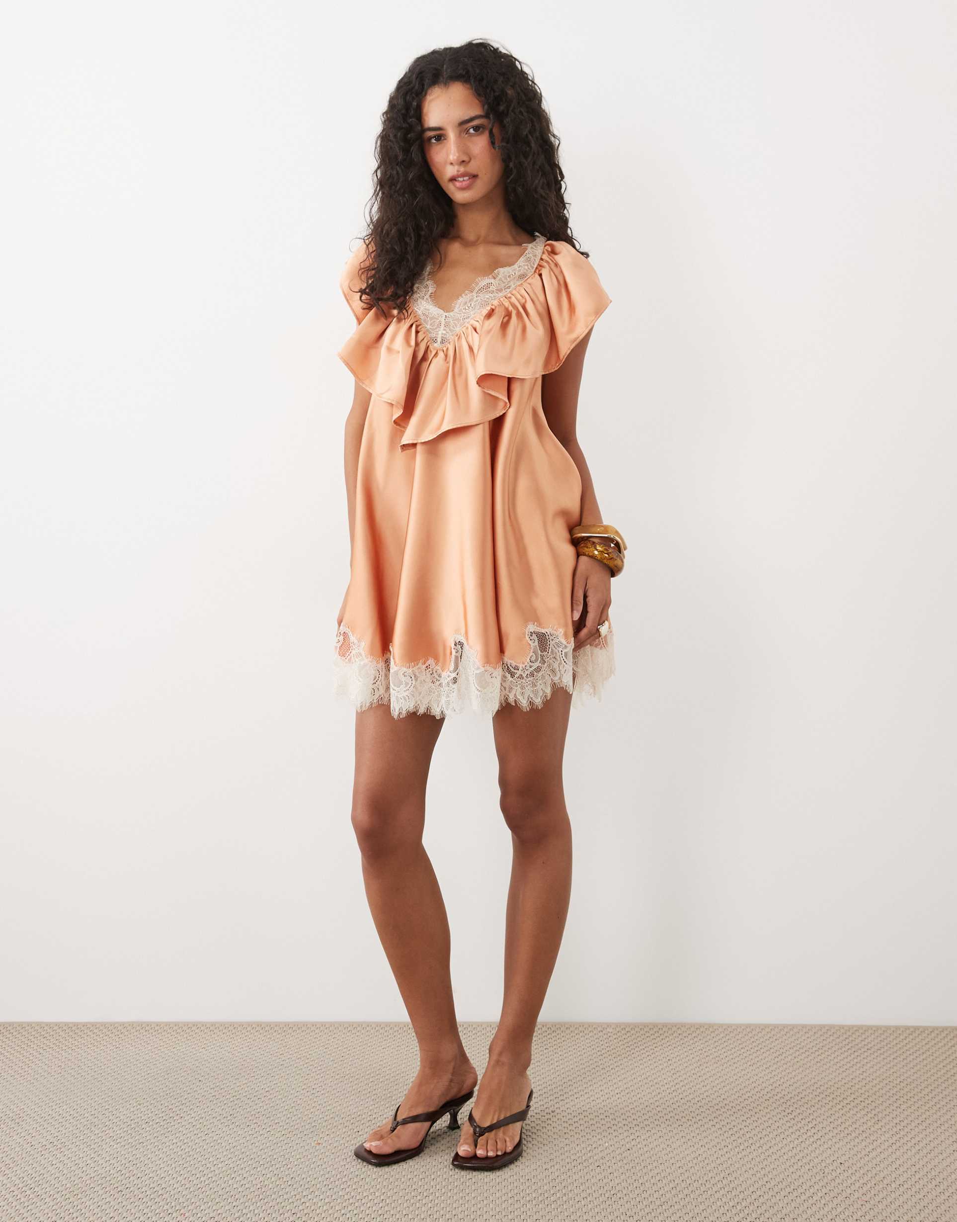asos design v neck satin ruffle mini dress with lace trim in peach