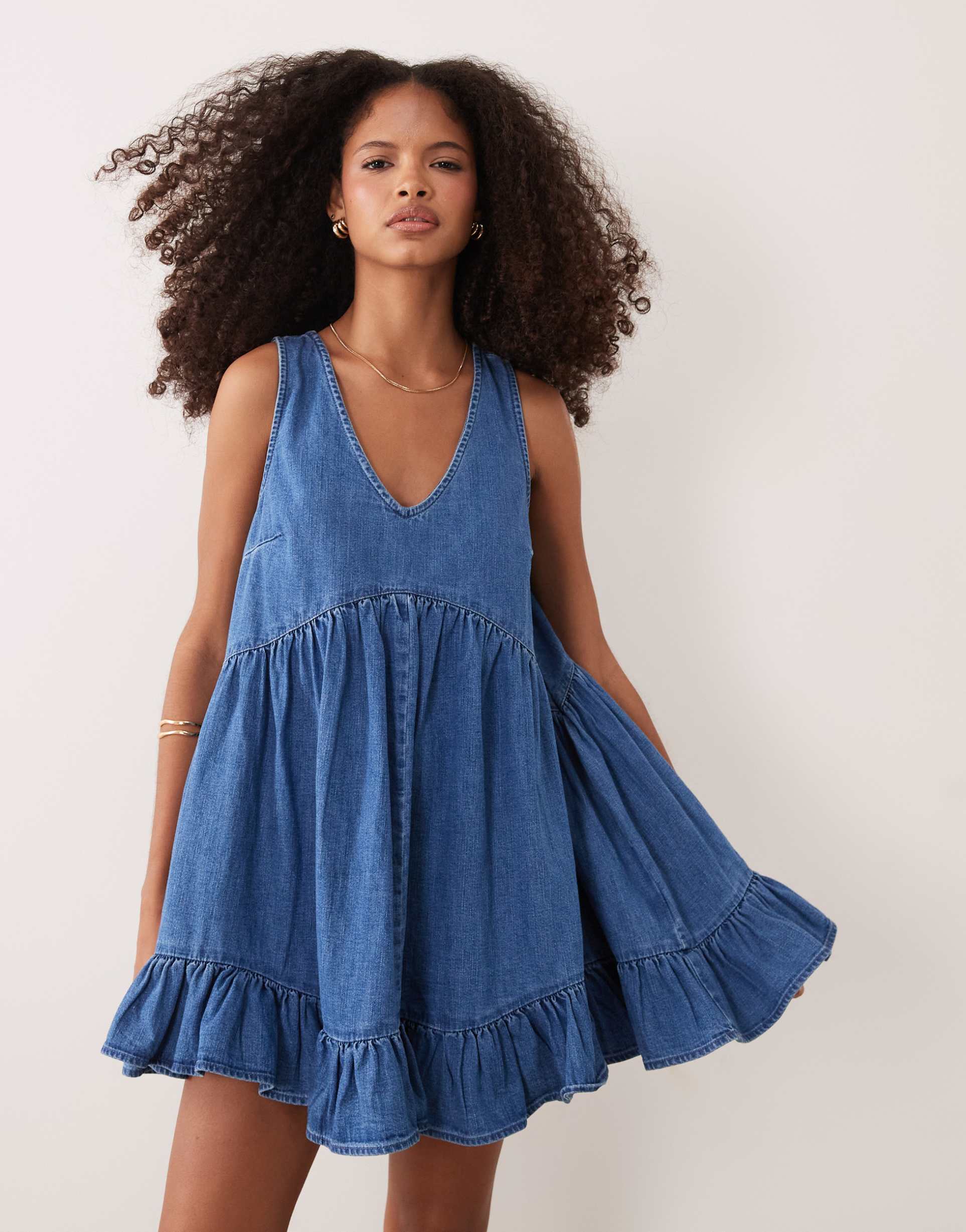 asos design v-neck tiered denim smock dress in light mid blue