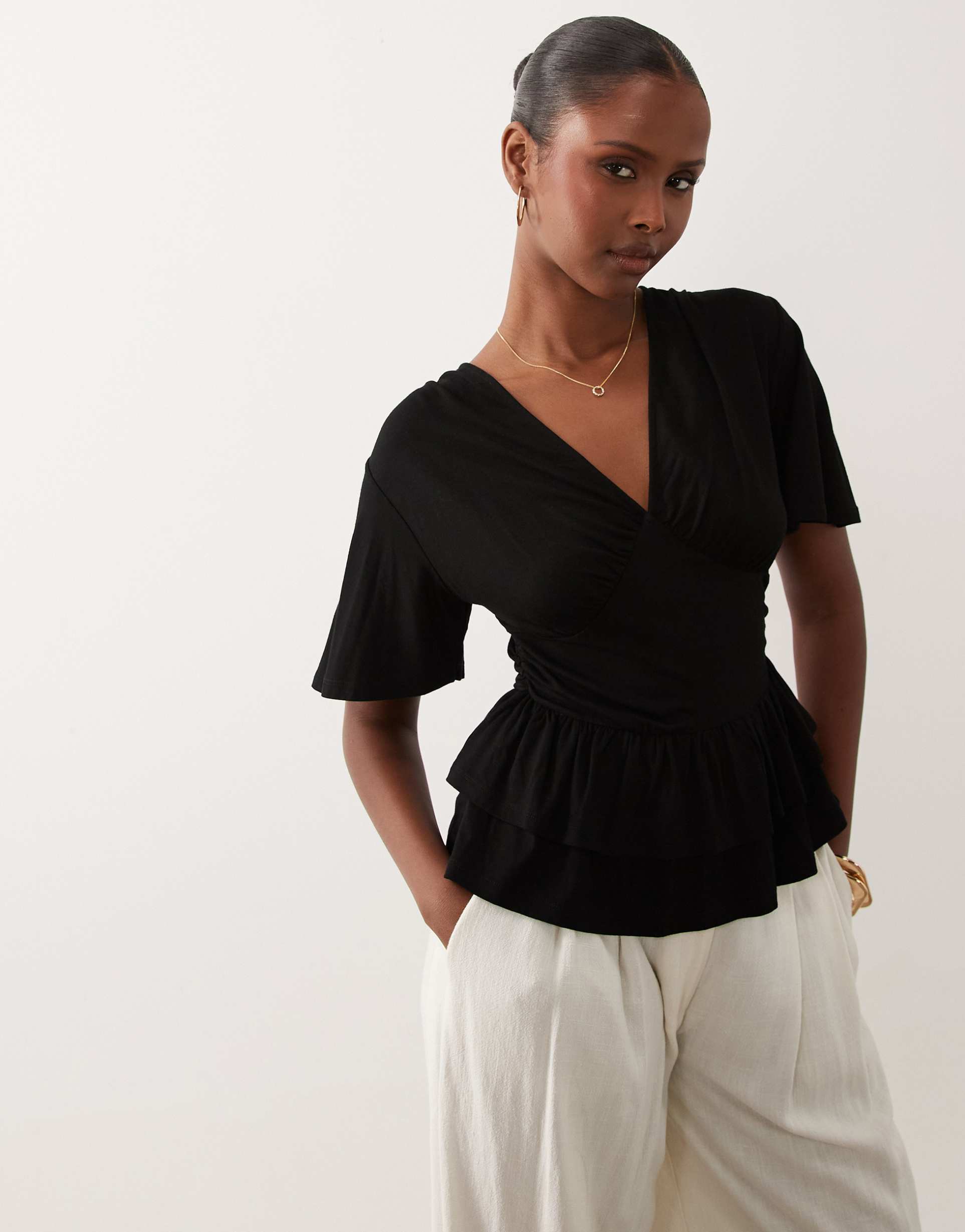 asos design v-neck top with ruffled peplum hem in black