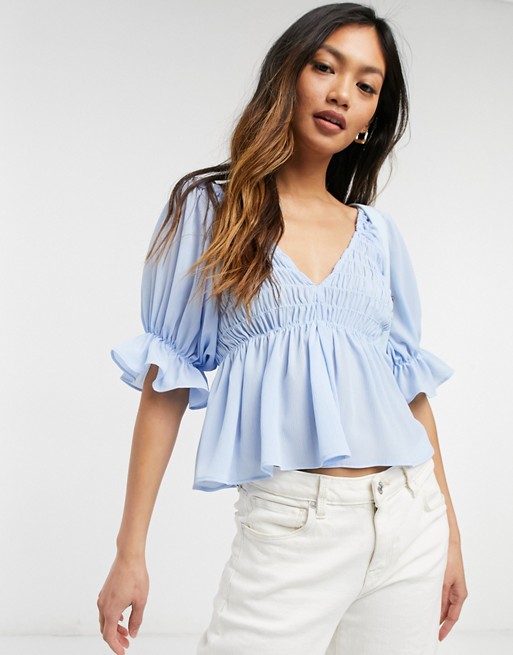 ASOS DESIGN v neck top with shirred waist and puff frill sleeve in light blue