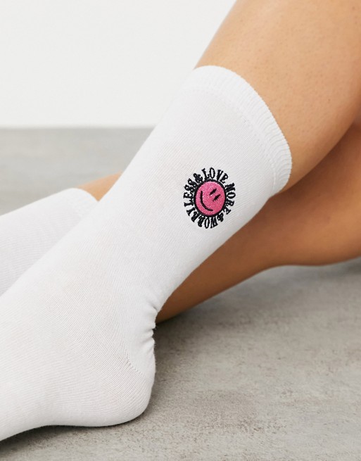 ASOS DESIGN love more slogan embroidered socks in white