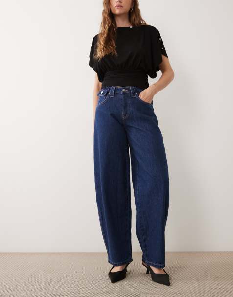 ASOS DESIGN vaquero de talle bajo con costuras en contraste, bolsillos parche traseros y lavado medio - view 1