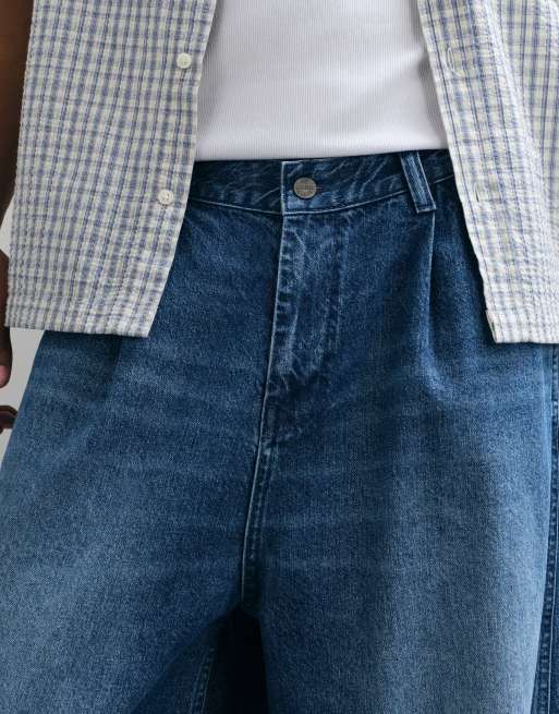 ASOS DESIGN vaqueros de pernera ancha en azul lavado medio con pinzas, 2 de 5