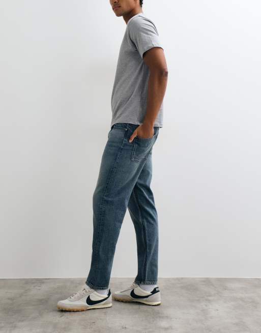 ASOS DESIGN vaqueros tapered en azul lavado oscuro, 2 de 5