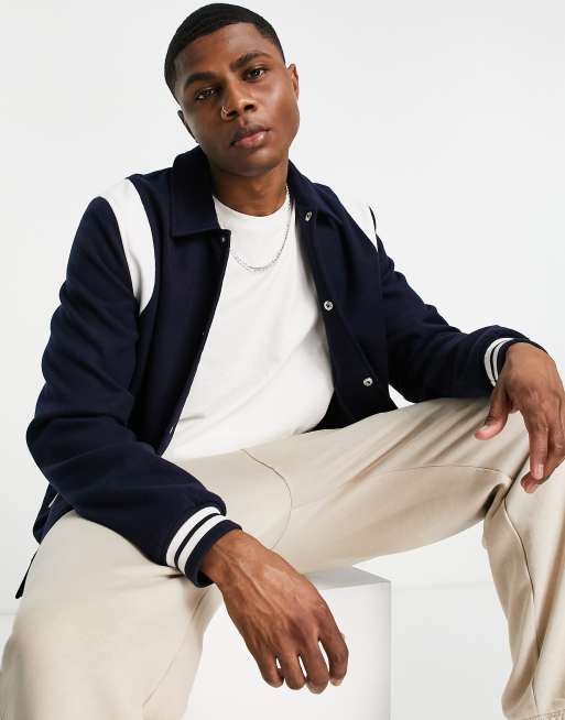 ASOS DESIGN varsity bomber jacket in navy with contrast white inserts