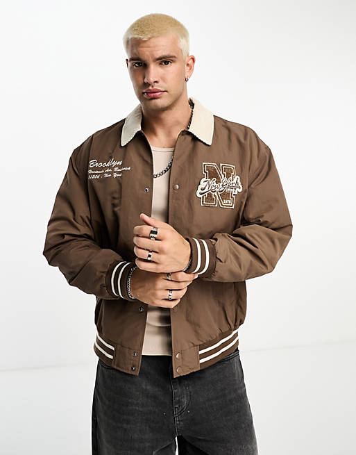 ASOS DESIGN varsity bomber jacket with contrast cord collar in brown | ASOS