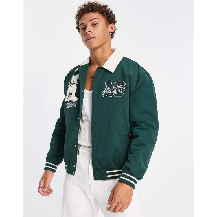 ASOS DESIGN oversized varsity bomber jacket in green and ecru cotton