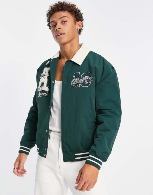 ASOS DESIGN oversized varsity jacket with real leather sleeves in green