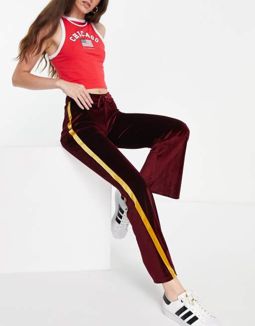 ASOS DESIGN velour flare trouser with varsity side stripe in burgundy