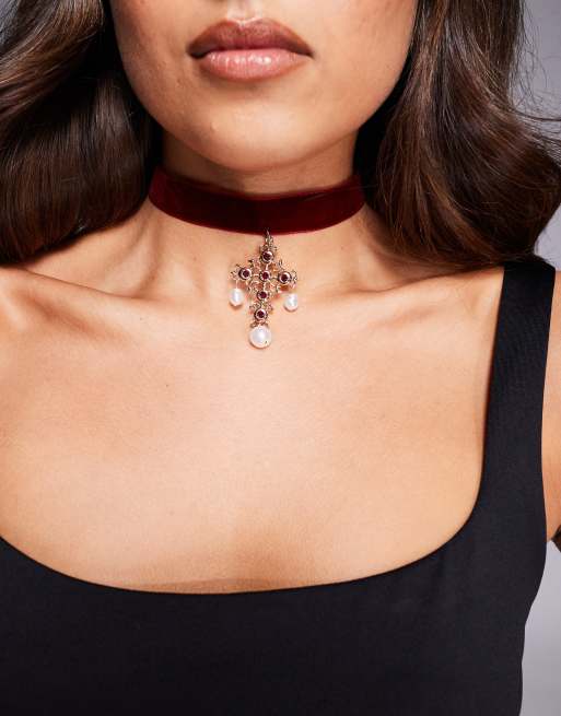 ASOS DESIGN velvet choker with cross and faux pearl details in burgundy