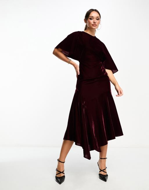 ASOS DESIGN velvet flutter sleeve asymmetric hem midi dress in burgundy